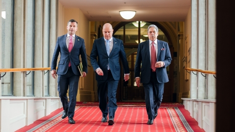 David Seymour, Christopher Luxon, and Winston Peters walk into the Beehive to sign the 2023 coalition agreements.