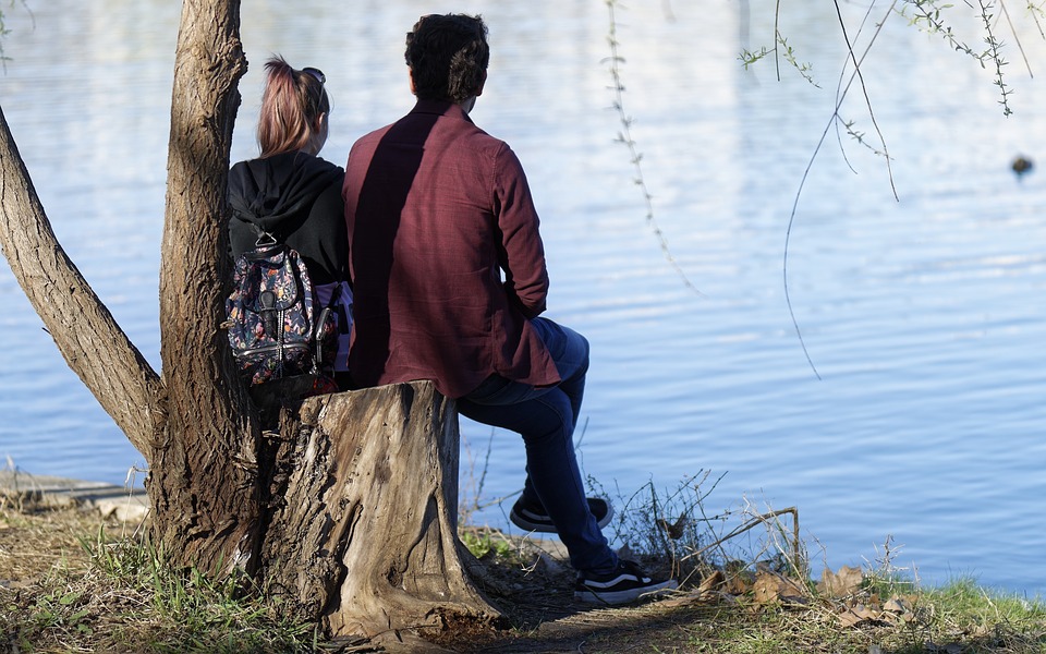 Young couple looking out over water