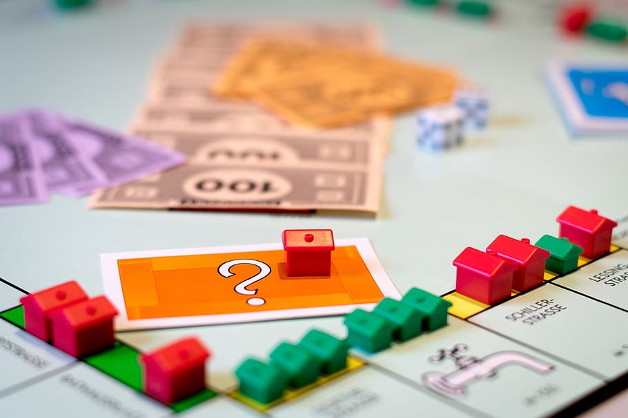 Monopoly board game with house and money tokens
