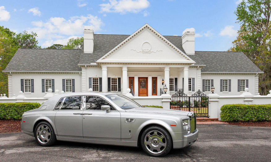 Rolls Royce in front of a house