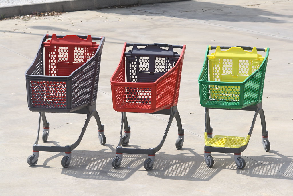 Three colourful shopping trolleys