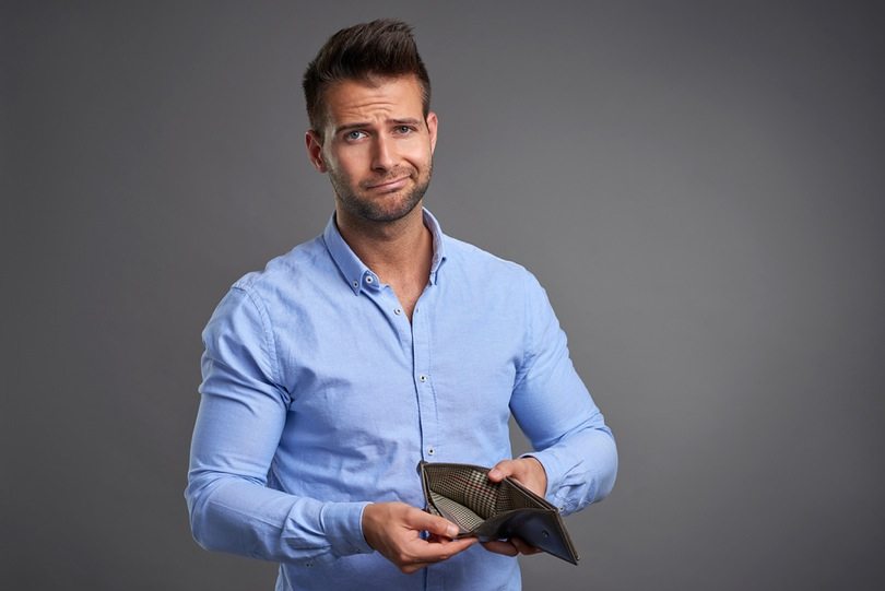 Man with empty wallet