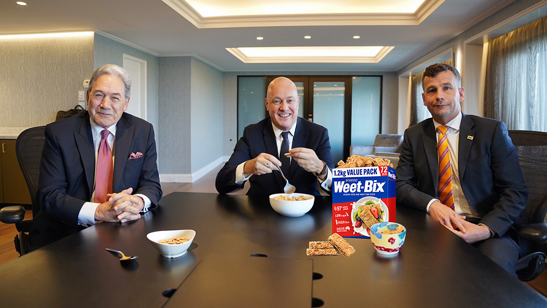 Winston Peters, Christopher Luxon, and David Seymour enjoy a hearty breakfast (generative AI-edited image) 