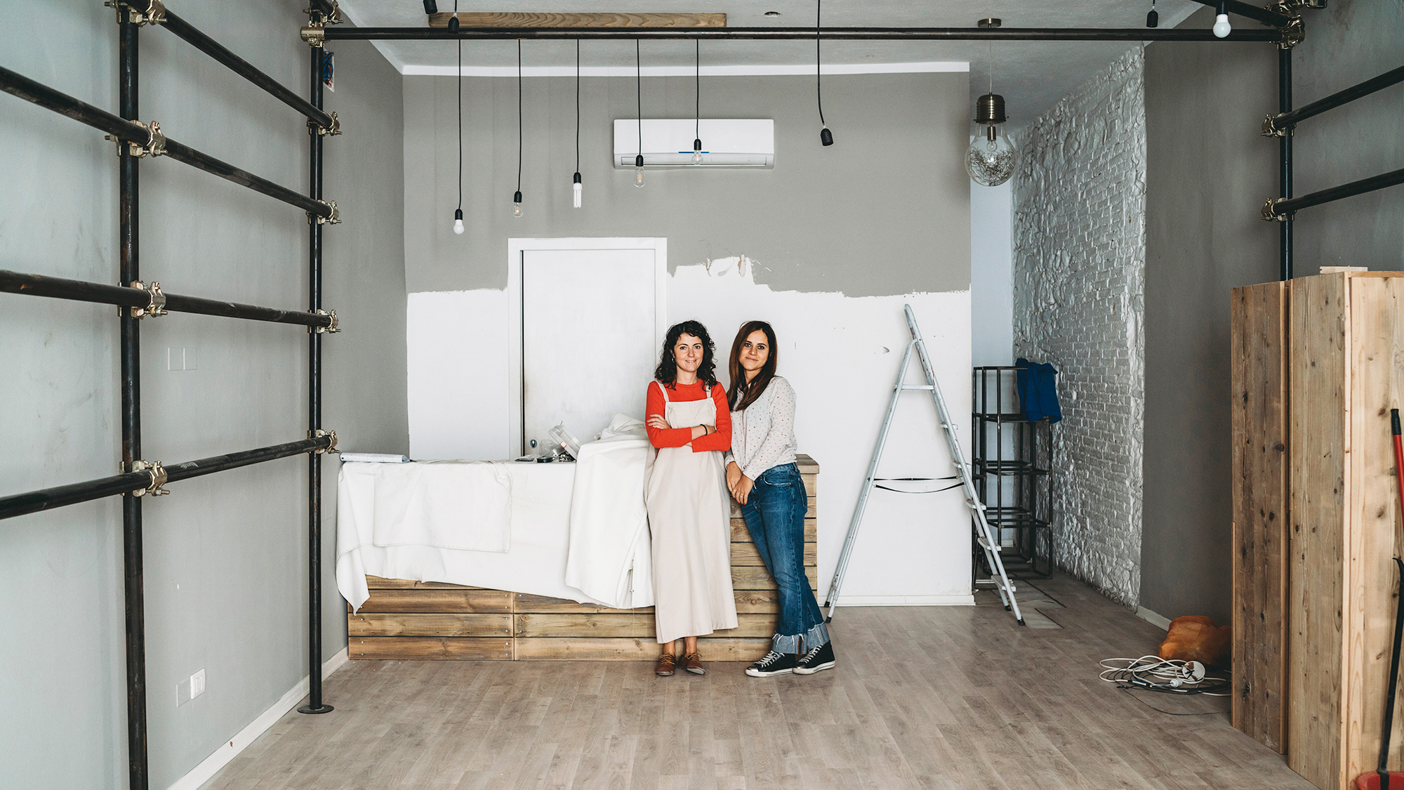 Two friends enjoying a break in a creative studio 2024