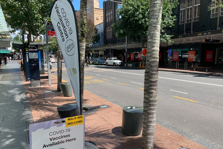 Covid vaccination sign and flag