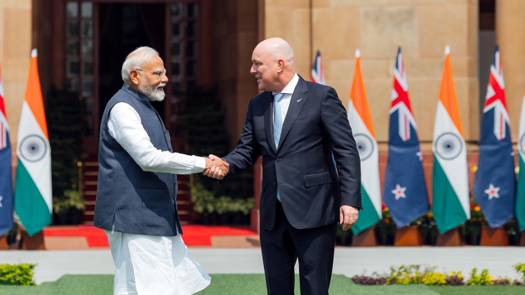 Modi and Luxon shake hands