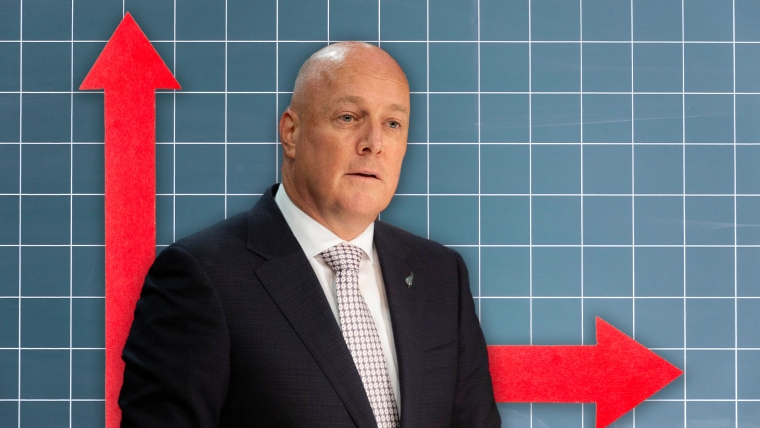 A composite image of a blue tiled backdrop with two red arrows - one pointing up and the other across, overlayed with an image of Prime Minister Christopher Luxon.