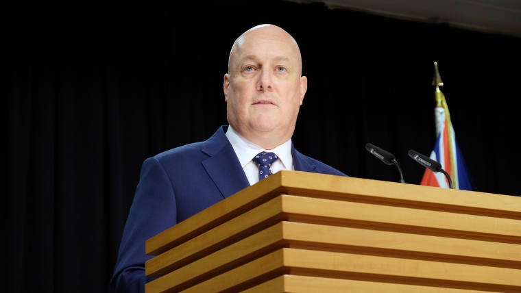 Prime Minister Christopher Luxon speaks to reporters.