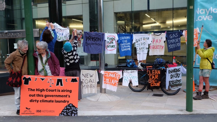 A 350 Aotearoa protest outside of Wellington High Court.