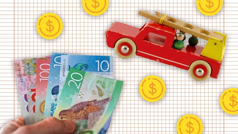 A composite image of grid paper overlayed with a toy fire truck, dollar signs and a hand holding New Zealand bank notes.