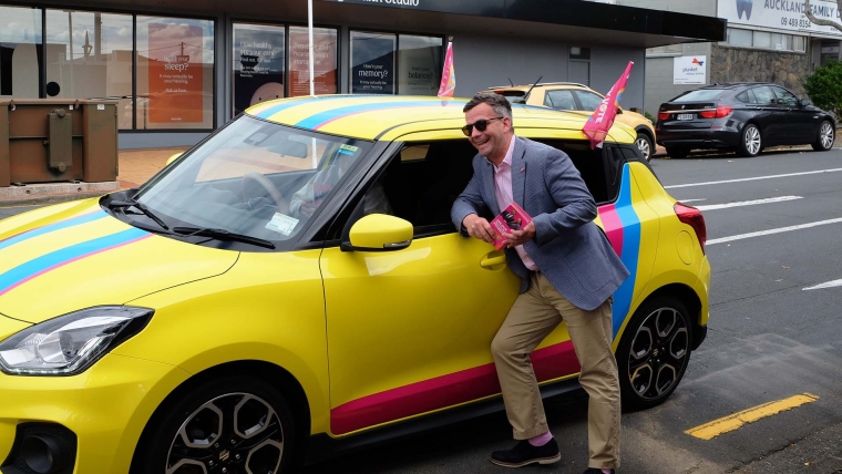 ACT leader David Seymour with a car in ACT party colours. Image source: Mandy Te