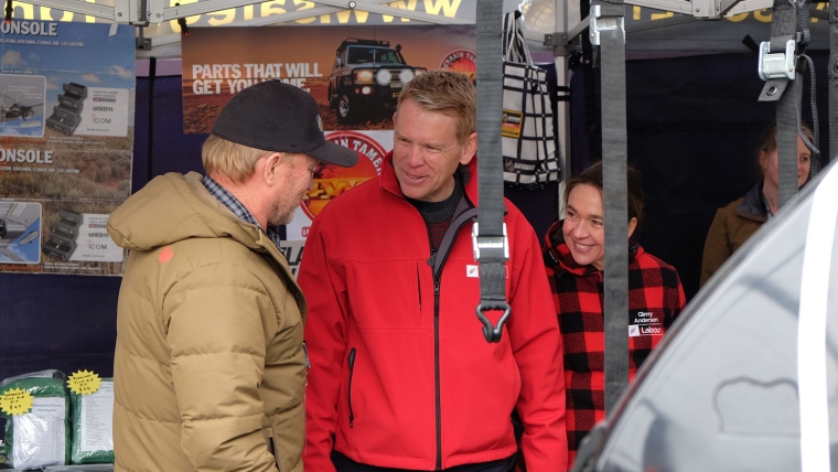 Labour's Chris Hipkins and Ginny Andersen with the stall operator of Safeguard Cargo nets while out on the election campaign trail in Upper Hutt. Image source: Aaron Masagnay