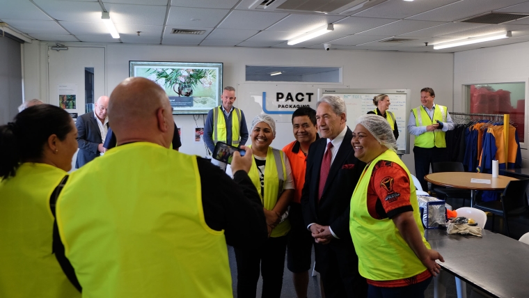 New Zealand First leader Winston Peters with staff from Pact Packaging. Image source: Mandy Te