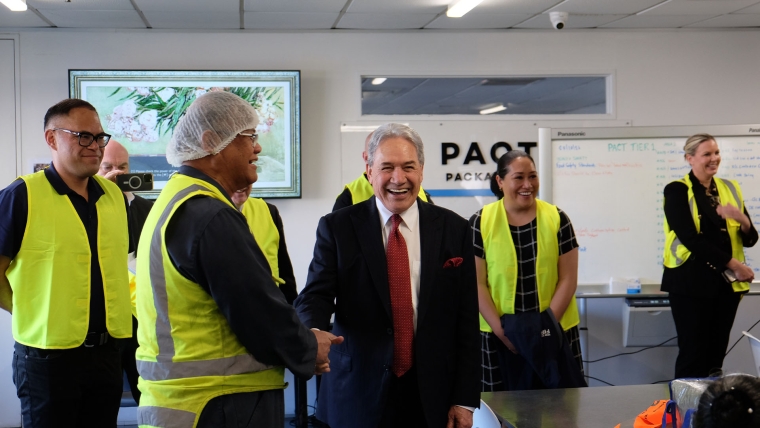 New Zealand First leader Winston Peters shakes hands with a staff member from Pact Packaging. Image source: Mandy Te