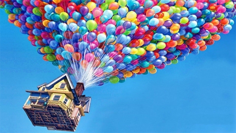 House floating in the sky under balloons