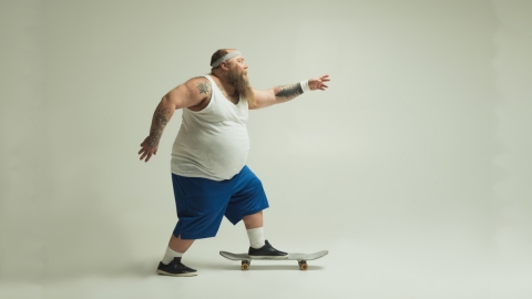 fat man on skateboard