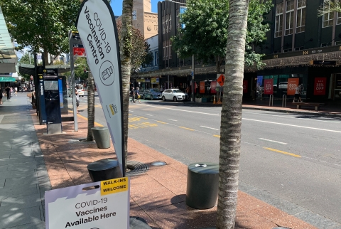 Covid vaccination sign and flag