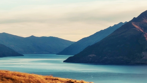 Mountains rising from placid lake