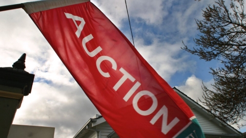 Auction flag outside house