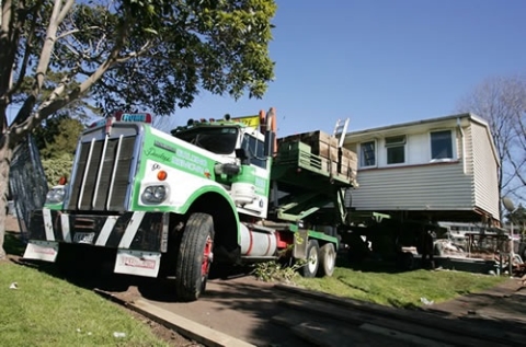 House being moved on truck