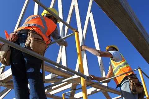 Builders on scaffolding