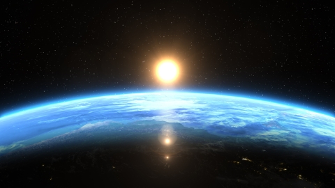 sun rising over Earth