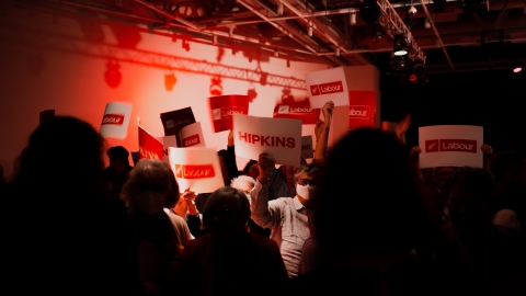 Hipkins' supporters wave signs 