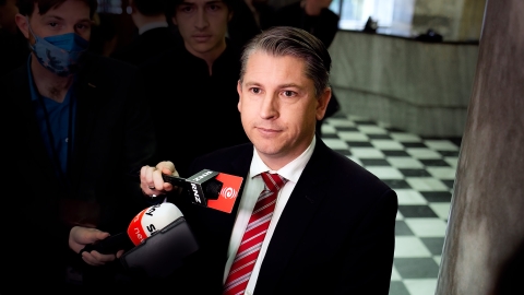 Labour Minister Michael Wood speaks to media in Parliament