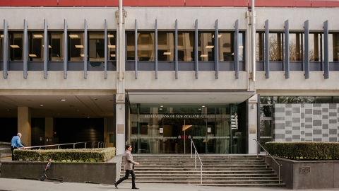 A man walks past the Reserve Bank on Wellington's The Terrace