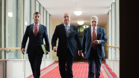 David Seymour, Christopher Luxon, and Winston Peters walk into the Beehive to sign the 2023 coalition agreements.