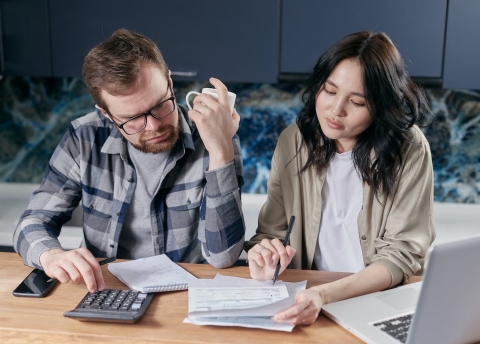 Young couple checking their finances