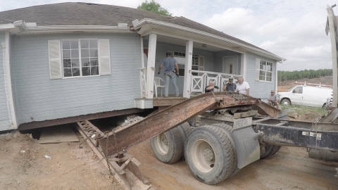 House fallen off truck