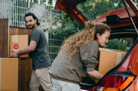 Young Couple Loading Car