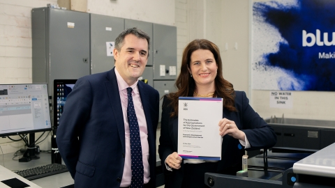 Chris Bishop and Nicola Willis printing copies of Budget 2024 in Petone