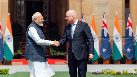 Modi and Luxon shake hands