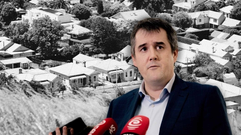 A cut out of Housing Minister Chris Bishop speaking to media overlayed on an image of houses in suburban Auckland.