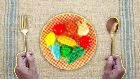 A composite image of a linen background overlayed with hands holding a knife and spoon, and a plate that has plastic vegetables on it.