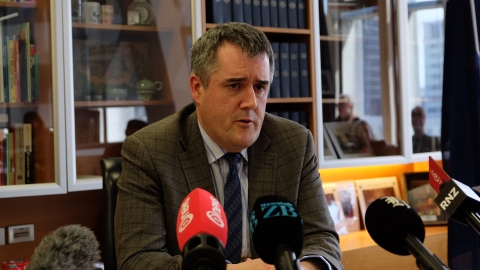 Housing Minister Chris Bishop speaks to reporters about a new development levies system.